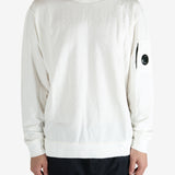 White crewneck worn by a person, showing the crewneck fit