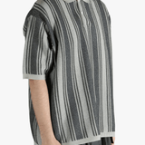 Grey sweat worn by a person, showing the sweat's fit