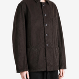 Brown jacket worn by a person, showing the jacket fit