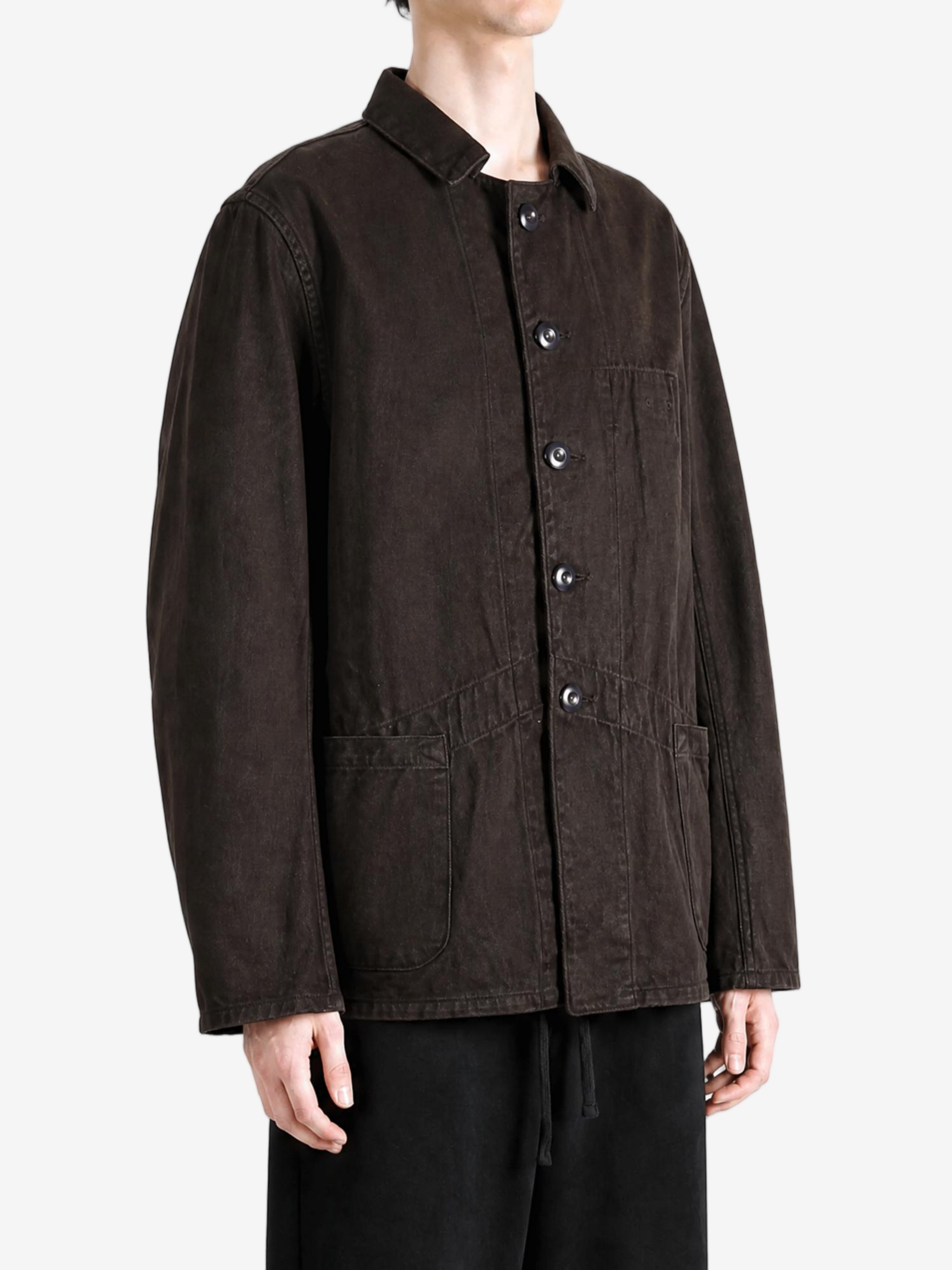 Brown jacket worn by a person, showing the jacket fit
