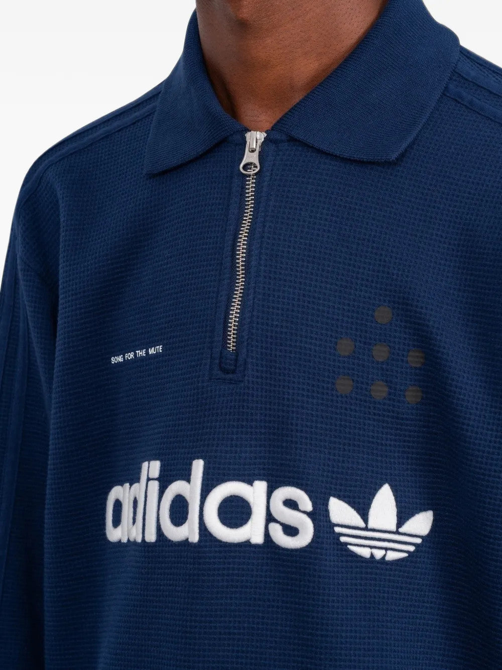 Navy shirt worn by a person, showing the shirt fit