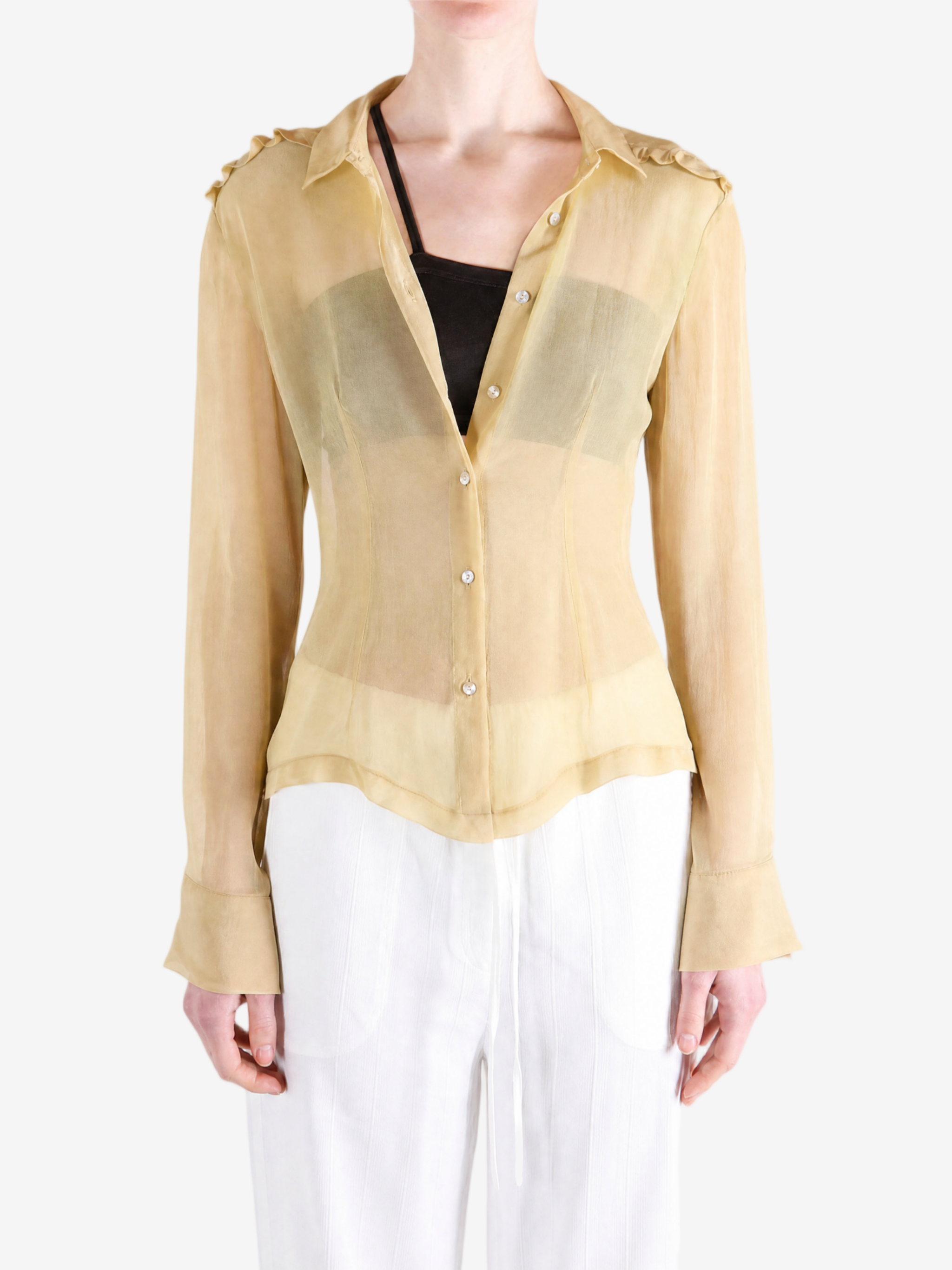 Tan shirt worn by a person, showing the shirt fit