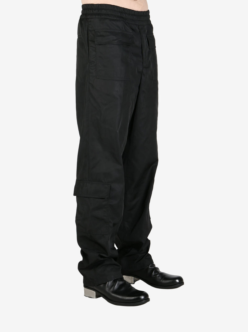 Black pendeen pants worn by a person, showing the pants's fit