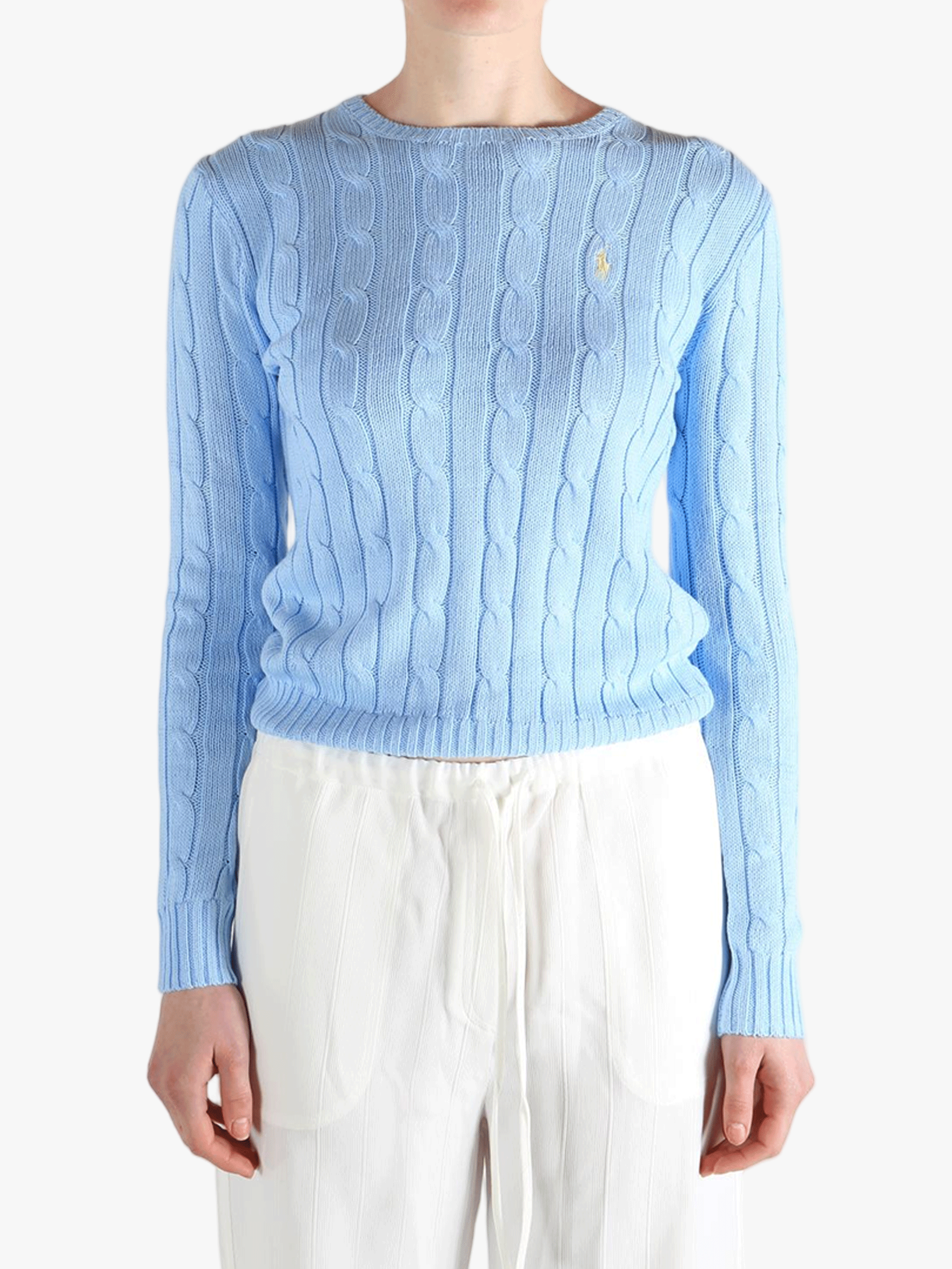 blue knitwear worn by a person, showing the knitwear  fit