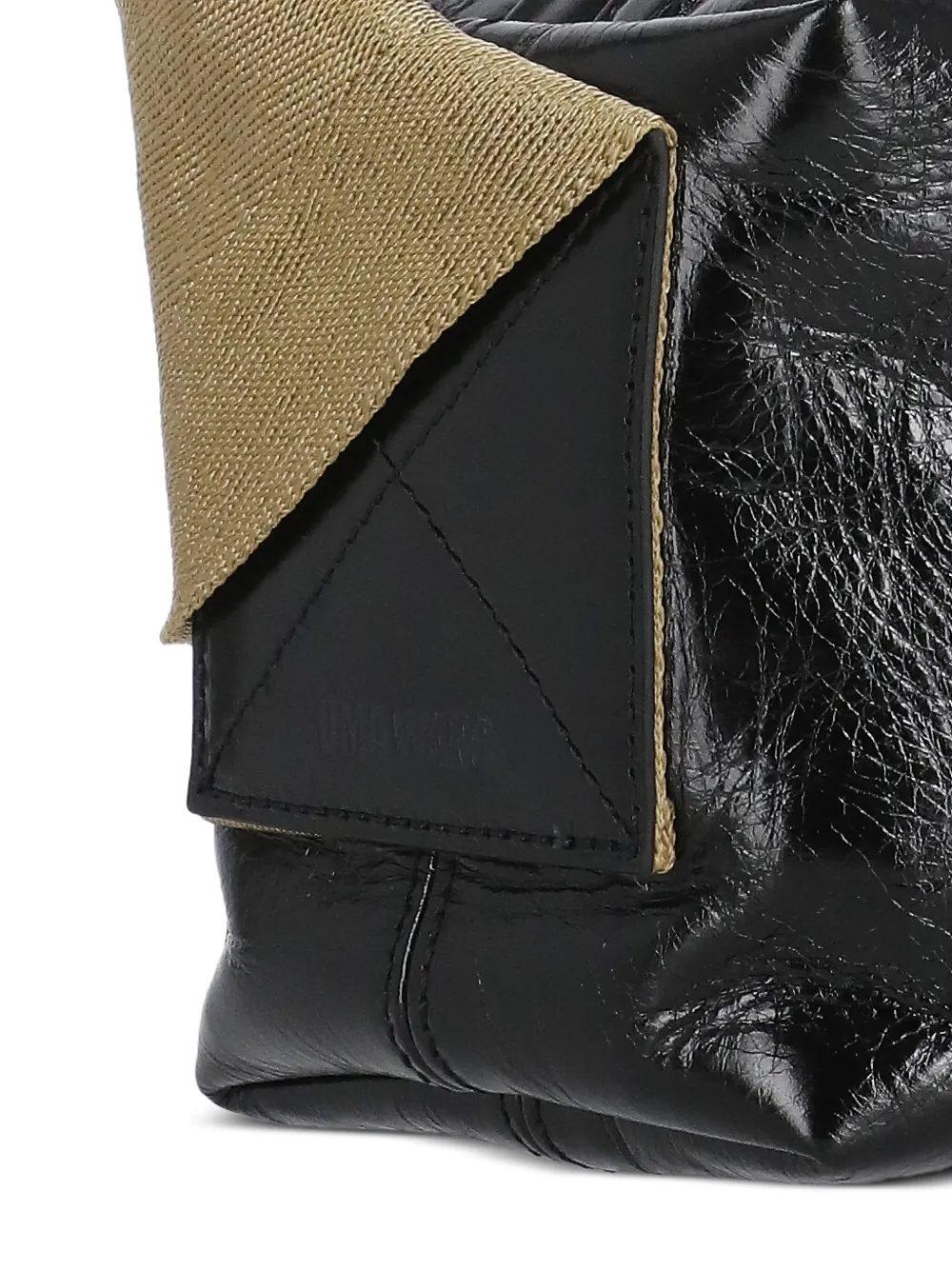 Close up of the black bag, showing texture of the leather fabric