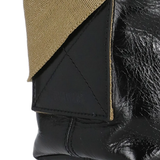 Close up of the black bag, showing texture of the leather fabric
