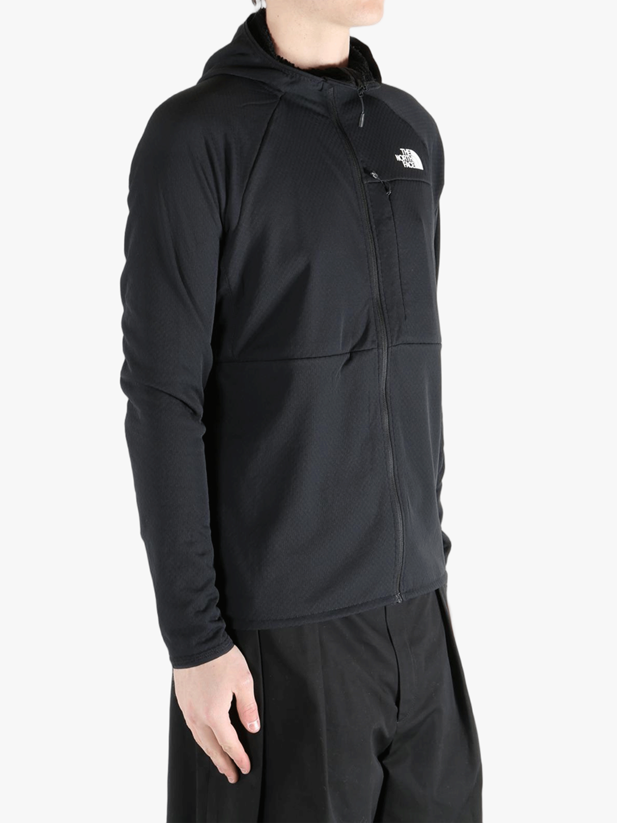 Black hoodie worn by a person, showing the hoodie's fit