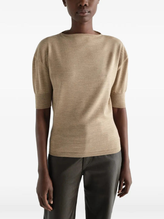Tan knitwear worn by a person, showing the knitwear fit