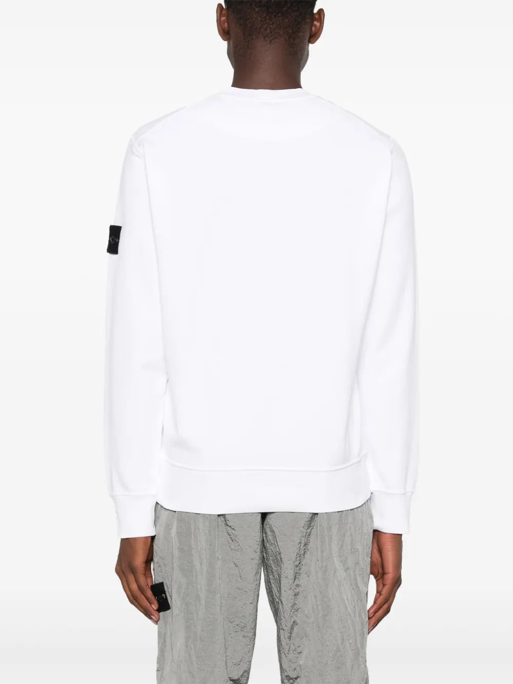 White sweatshirt worn by a person, showing the sweatshirt fit