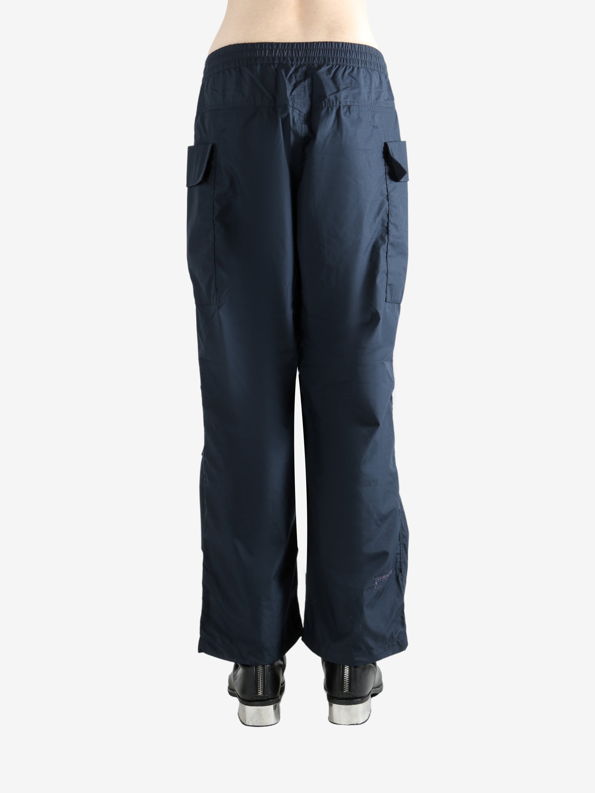 Navy pants worn by a person, showing the pants' fit