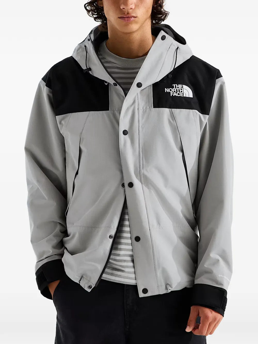 Grey jacket worn by a person, showing the jacket fit