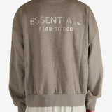 Grey tops worn by a person, showing the  tops fit