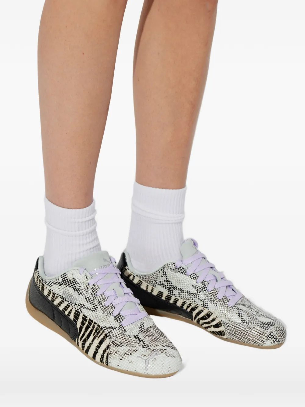 Close up of black flats, showing texture of the polyurethane fabric