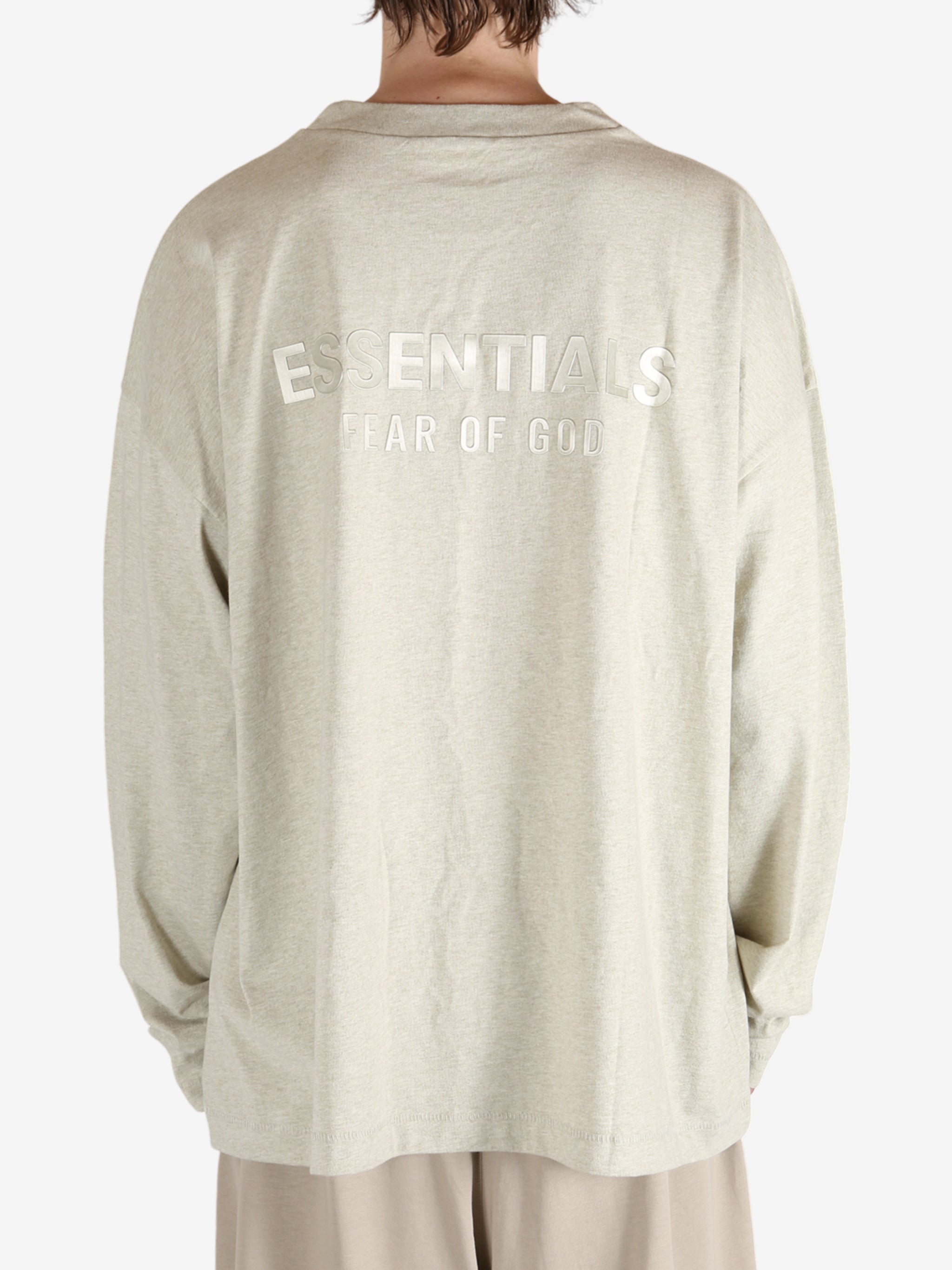 Tan tops worn by a person, showing the tops fit