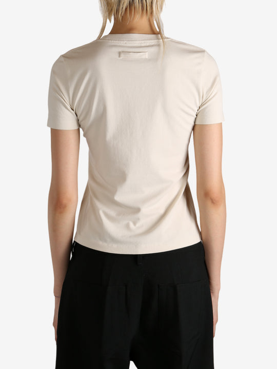 Tan t-shirt worn by a person, showing the  t-shirt fit