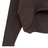 Close up of brown knitwear, showing texture of the cashmere fabric