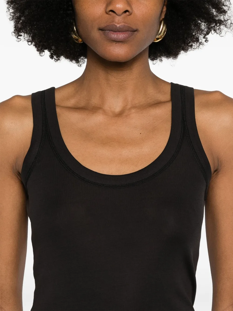 Close up of black tops, showing texture of the cotton fabric