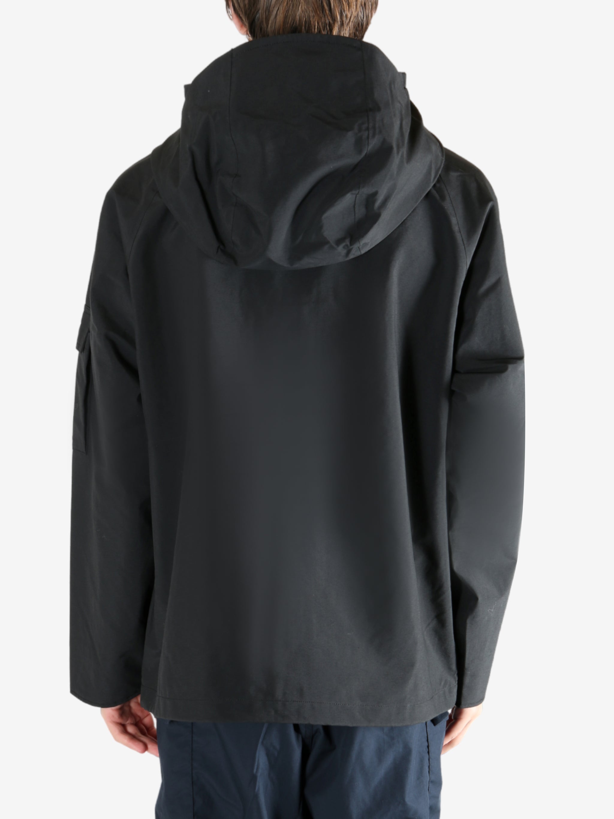 Black jacket worn by a person, showing the jacket's fit