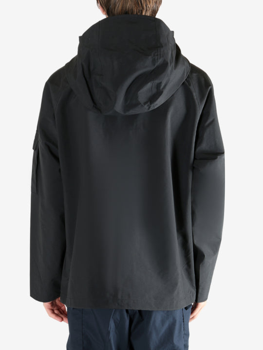 Black jacket worn by a person, showing the jacket's fit