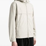 Grey jacket worn by a person, showing the jacket fit