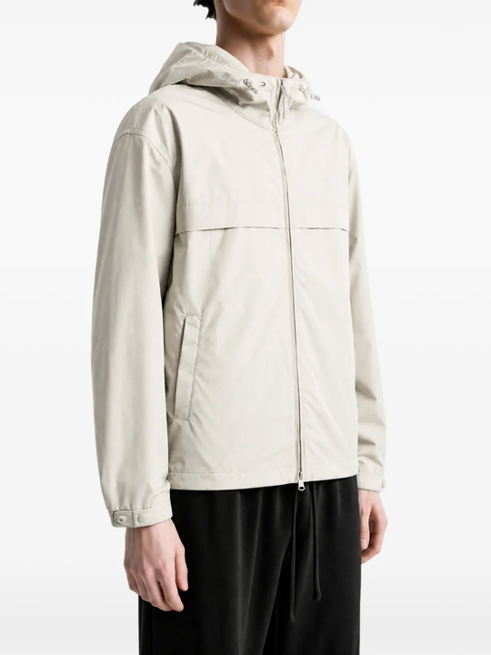 Grey jacket worn by a person, showing the jacket fit