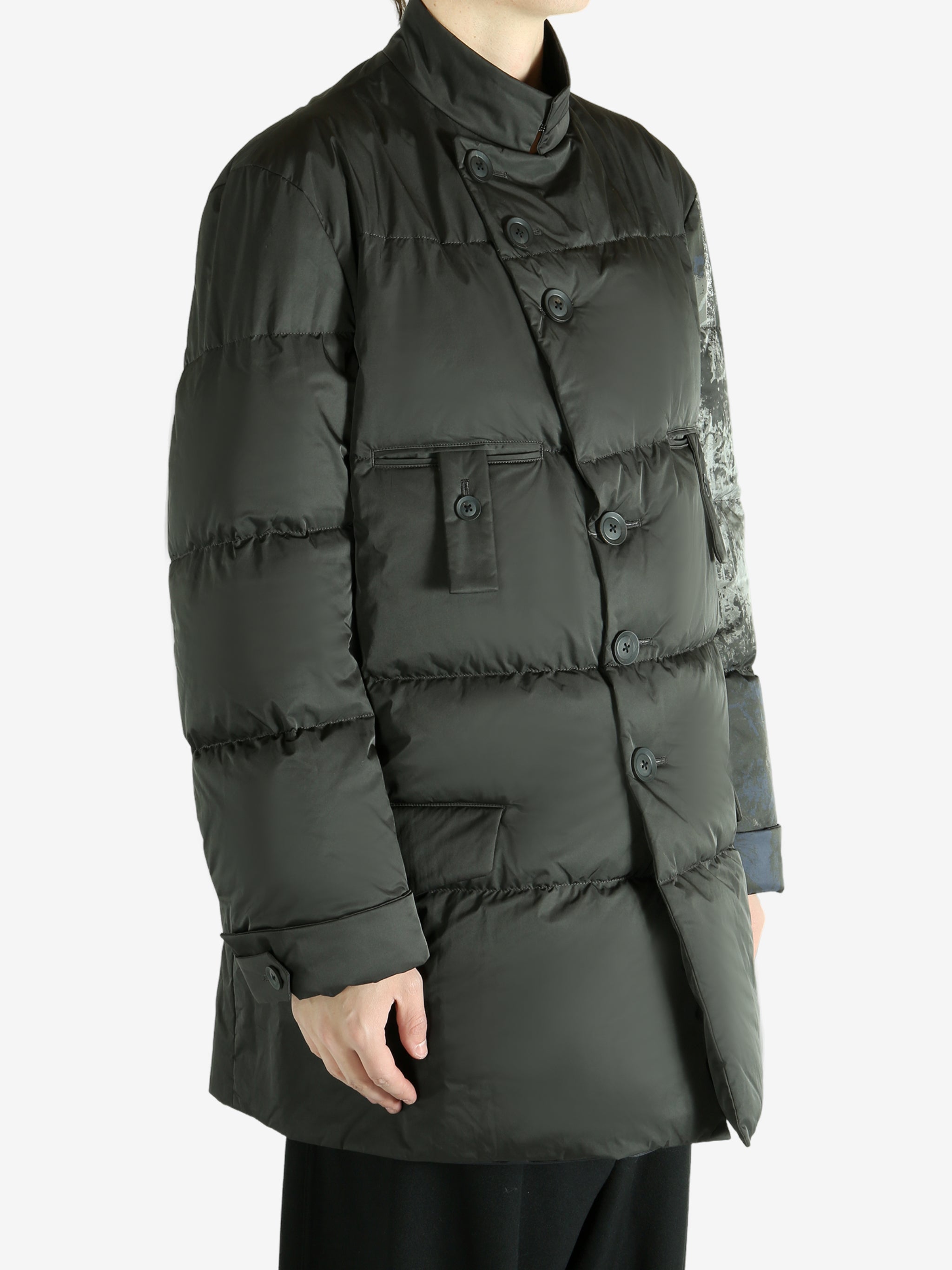 Black jacket worn by a person, showing the jacket's fit