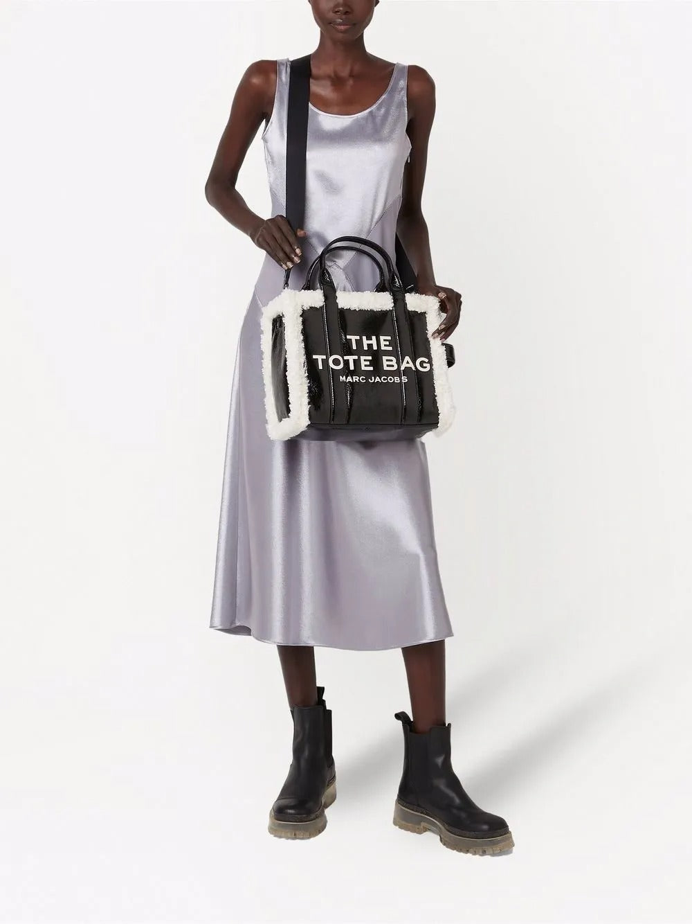 Black bag carried by a person, showing the bag's fit