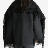 Black jacket worn by a person, showing the jacket's fit