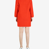 Orange dresses worn by a person, showing the dress's fit