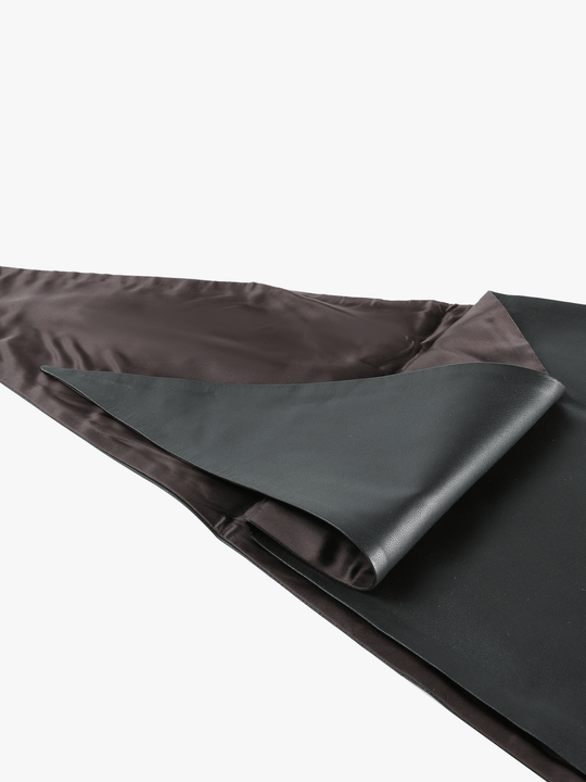 Close up of black scarf, showing texture of the cotton fabric