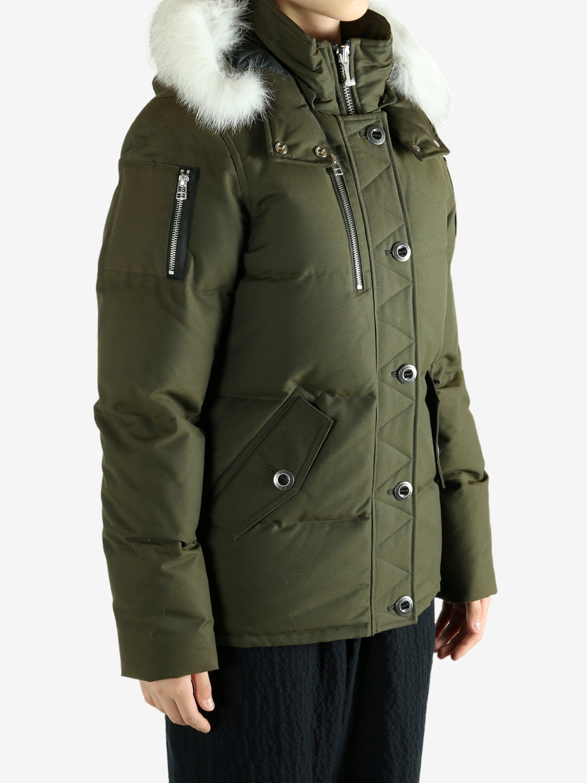 Green jackets worn by a person, showing the jackets fit