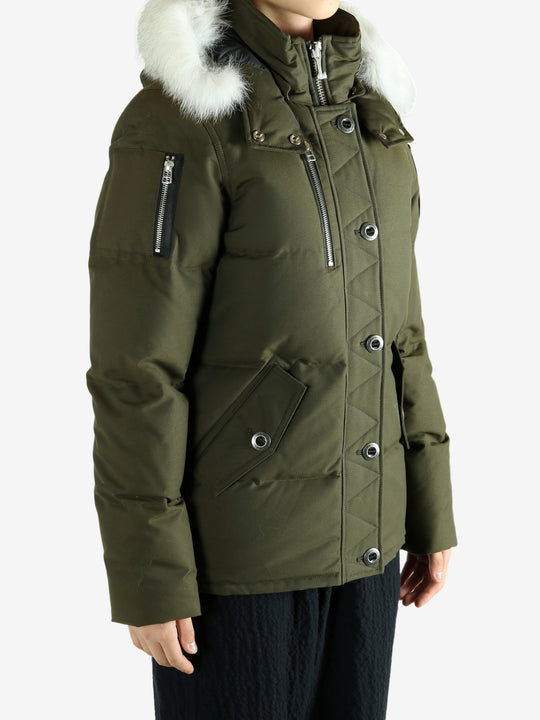 Green jackets worn by a person, showing the jackets fit