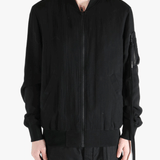 Black jackets-coats worn by a person, showing the cotton fit