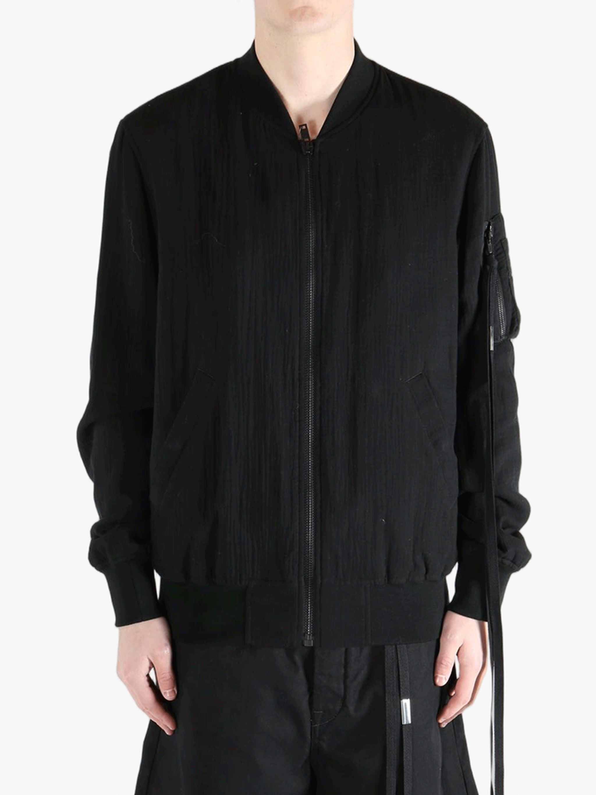 Black jackets-coats worn by a person, showing the cotton fit