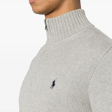 Close up of grey knitwear, showing texture of the cotton fabric