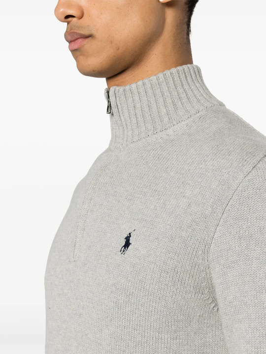 Close up of grey knitwear, showing texture of the cotton fabric