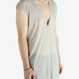 White t-shirt worn by a person, showing the shirt's fit