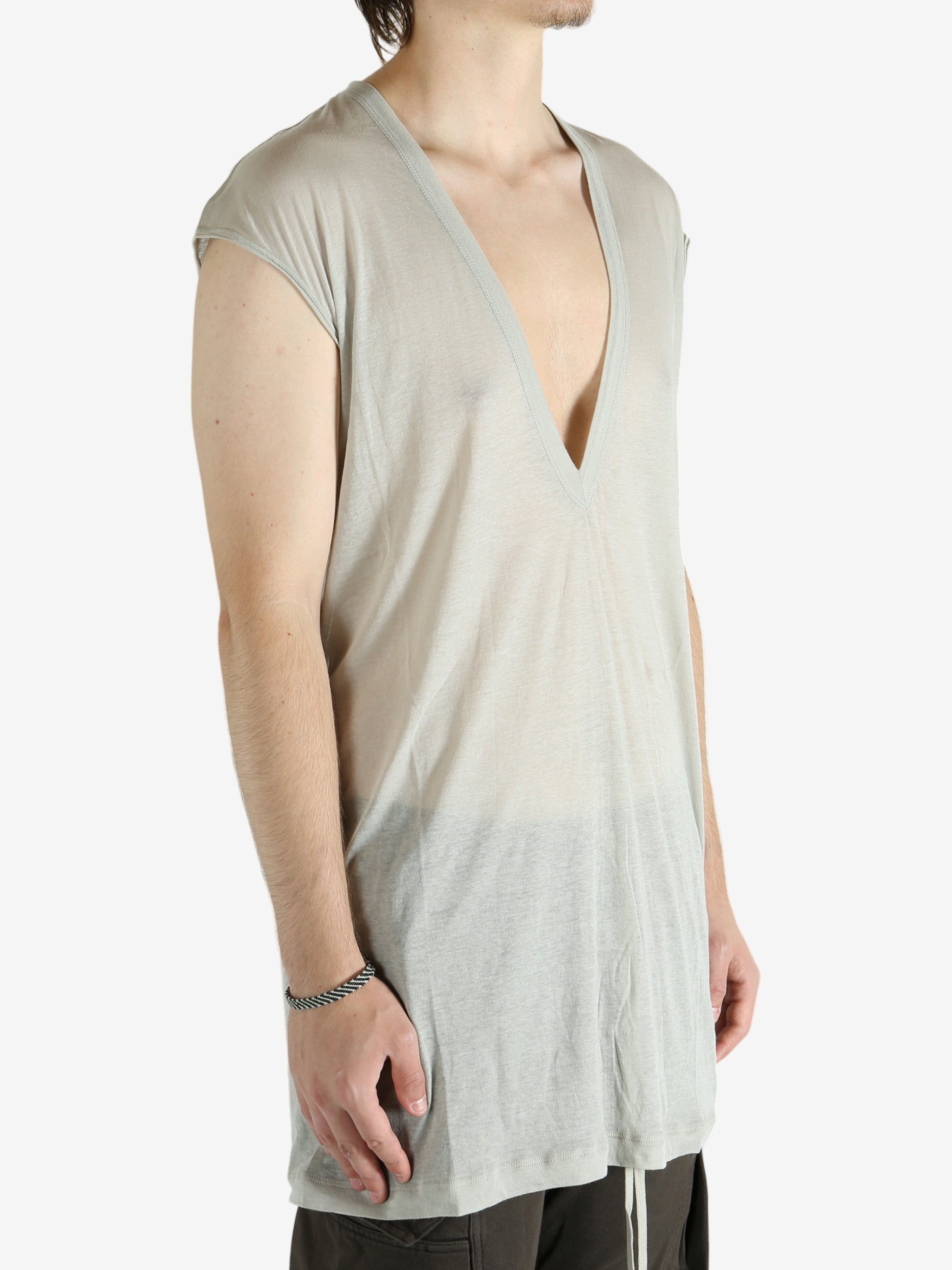 White t-shirt worn by a person, showing the shirt's fit