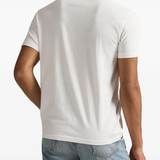 White t-shirt worn by a person, showing the t-shirt fit