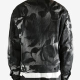 Black jacket worn by a person, showing the jacket's fit