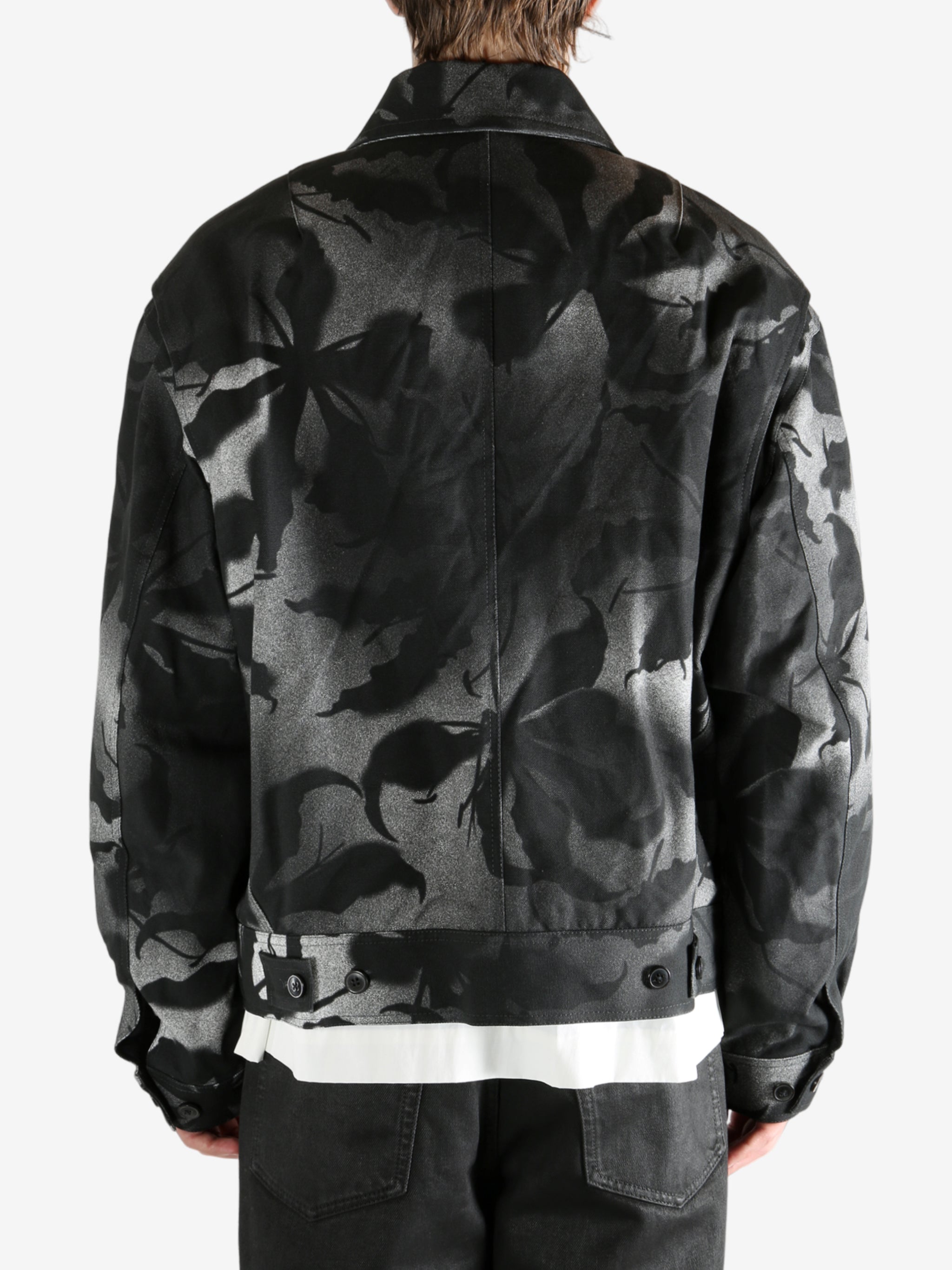 Black jacket worn by a person, showing the jacket's fit