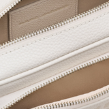 Close up of pink bag, showing texture of the leather fabric