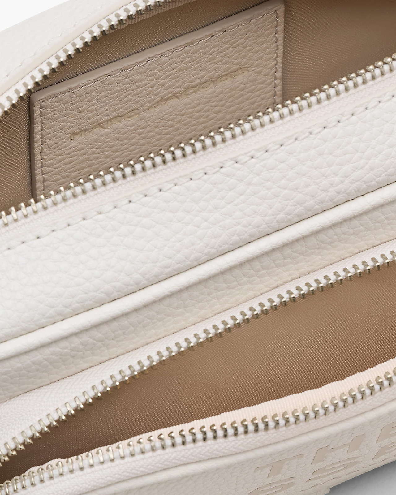 Close up of pink bag, showing texture of the leather fabric