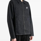 Black jacket worn by a person, showing the jacket fit