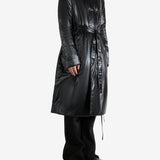 Black coat worn by a person, showing the coat's fit