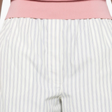 Close up of white pants, showing texture of the Cotton fabric