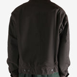 Brown jacket worn by a person, showing the jacket's fit