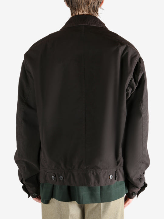 Brown jacket worn by a person, showing the jacket's fit