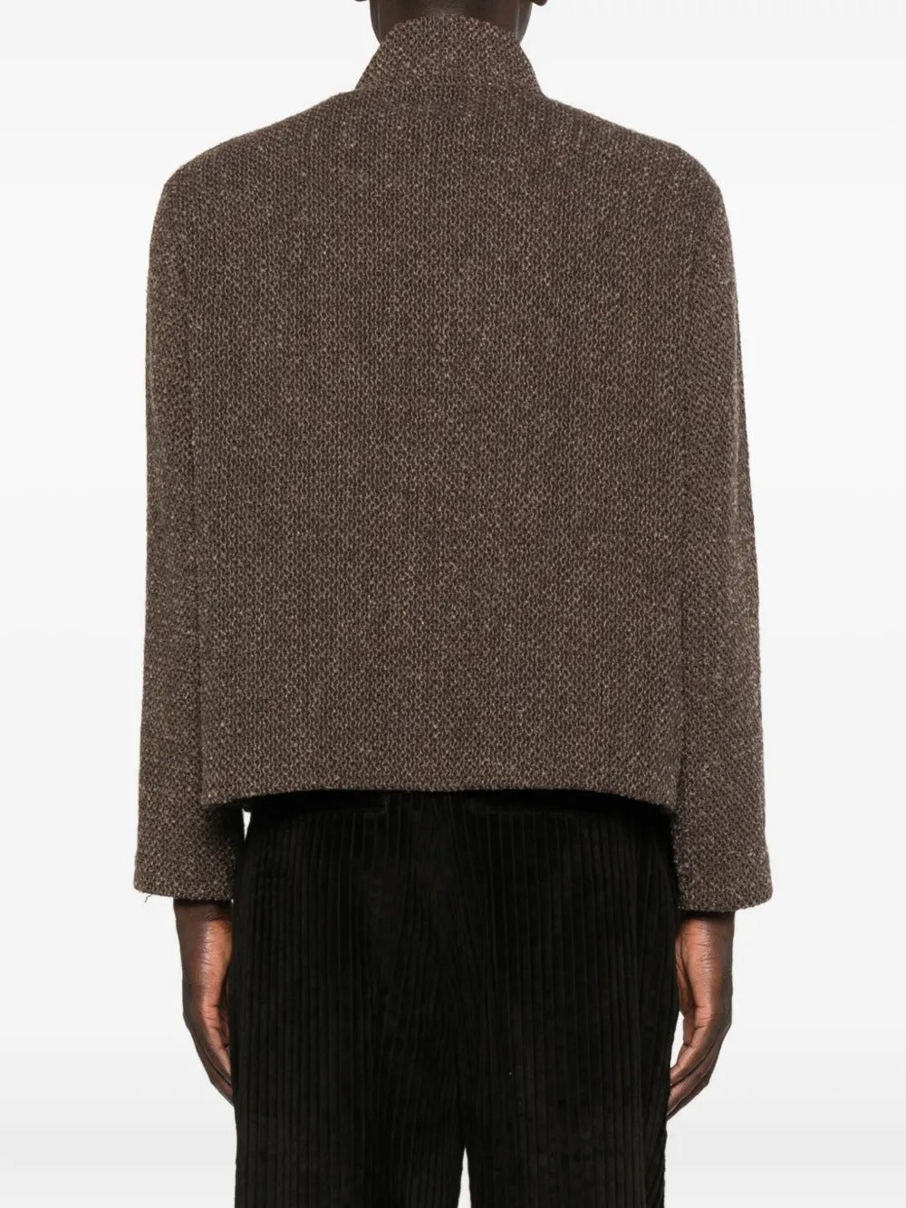 Brown coat worn by a person, showing the coat's fit