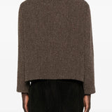 Brown coat worn by a person, showing the coat's fit